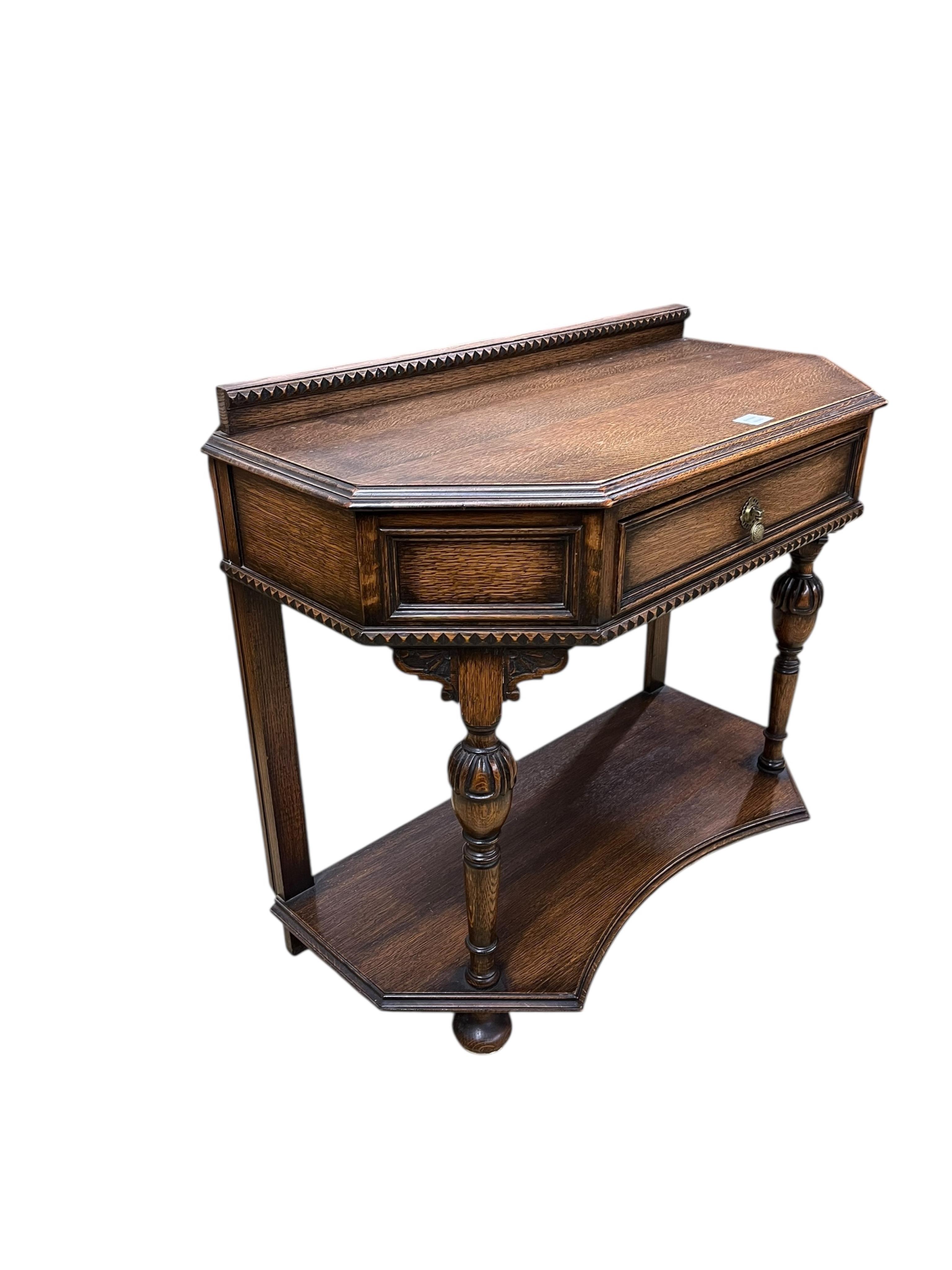 A Jacobean Revival oak two tier side table, width 90cm, depth 46cm, height 82cm